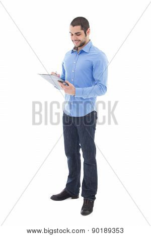 Young Handsome Arabic Man Writing Something On Clipboard Isolated On White