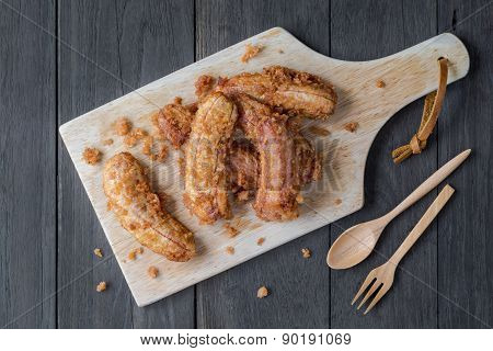 Banana Frield With Wood Block On Wood Board Background