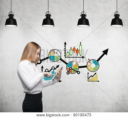 Young Beautiful Business Woman Is Thinking About Business Optimisation Process By Working On The Tab
