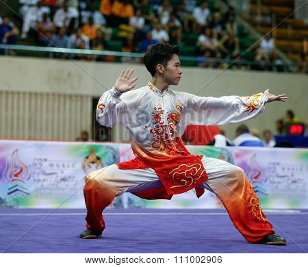 JAKARTA, INDONESIA - NOVEMBER 15, 2015: Yu Wei Chen of Chinese Taipei performs the movements in the men's Taijiquan event at the 13th World Wushu Championship 2015 held in Istora Senayan, Jakarta.