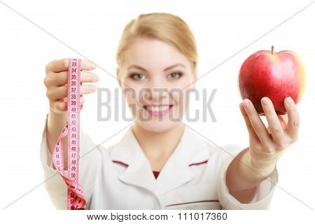 Doctor Specialist Holding Fruit Apple And Measure Tape