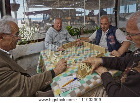 Turkish Men Playing Rummy Tile Game Near The Seaside