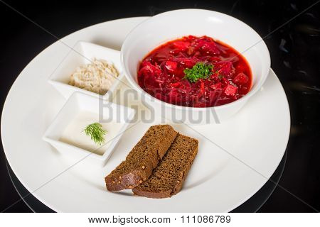 Borsch with creme fraiche, lard and bread