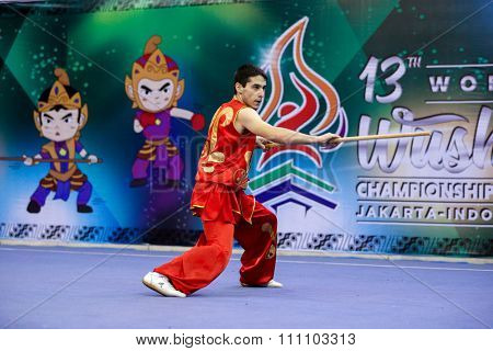 JAKARTA, INDONESIA - NOVEMBER 16, 2015: Gevorg Yeritsyan of Armenia performs the movements in the Men's Nangun event at the 13th World Wushu Championship 2015 at the Istora Senayan Stadium.