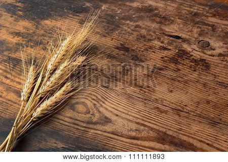 Ears Of Wheat On Wooden Table