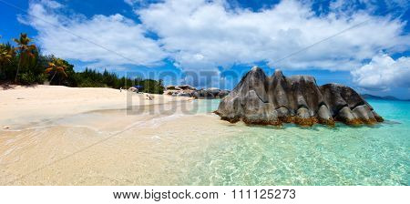 Beautiful tropical beach with white sand, turquoise ocean water and blue sky at Virgin Gorda, British Virgin Islands in Caribbean