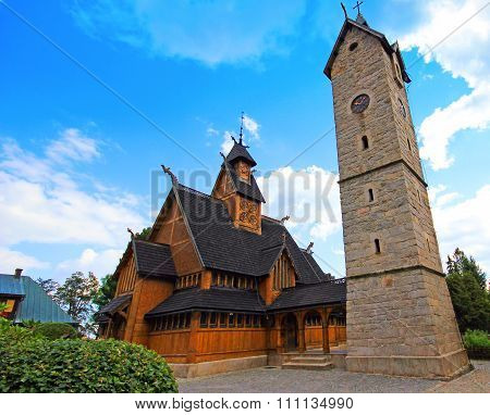 Old wooden Vang stave church with tower of stone in the Karpacz, Karkonosze mountains, Poland