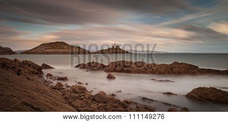 Bracelet Bay and Mumbles lighthouse