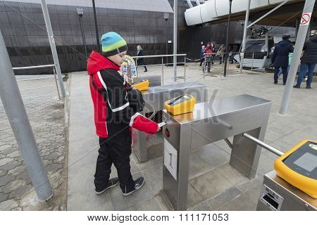 Nizhny Novgorod, RUSSIA - November 04.2015. The boy goes through the turnstile cable car. It across