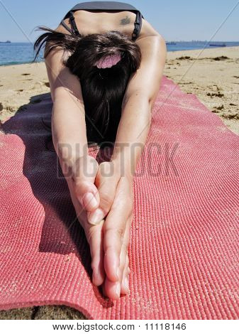 Bikram Yoga Ardha Kurmasana Pose At Beach