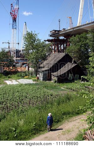 Construction Of Cable-stayed Bridge Over Residential Farmhouse In Russian Village.
