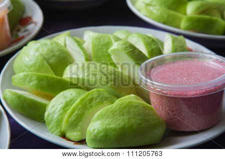 Slice Of Guava On Dish With Red Salt And Chilli