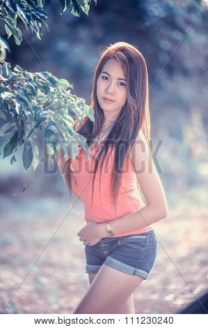 Asia Young Woman Wearing Pink Vest  And Short Jeans