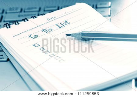 Close Up The Handwritten To Do List Plan In Small Note Book , Modern Blue Colortone