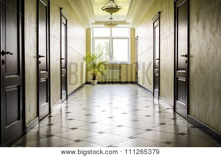 Kiev Ukraine - July 6 2015: White Hallway With Marble Floor, Brown Doors And Window In Hospital