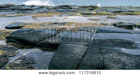 Rocks and waves at Point Cartwright
