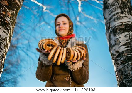young beautiful woman in national ukraine suite at snowy winter