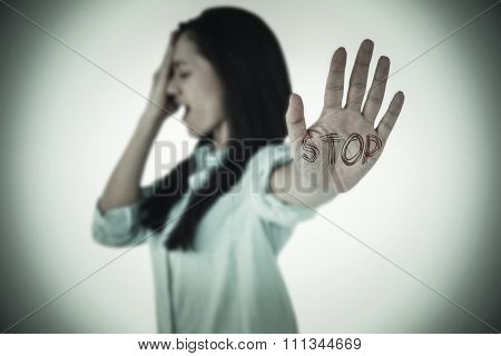 Irritated woman showing her hand against please stop