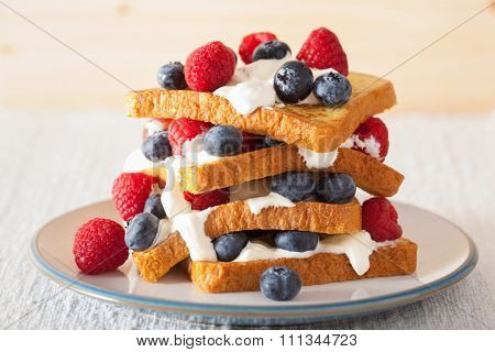 french toasts with creme fraiche and berries for breakfast