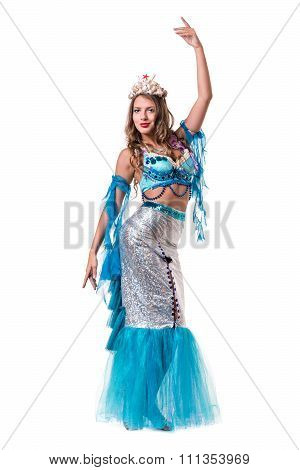 Carnival dancer girl dressed as a mermaid posing, isolated on white