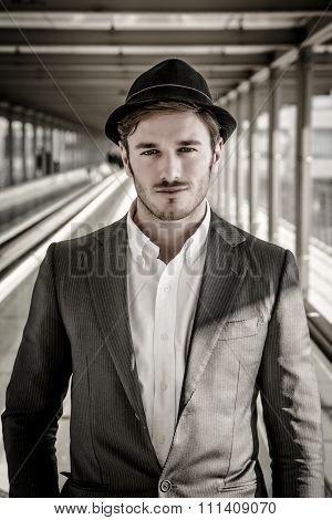 Man Wearing Hat and Looking Out Window