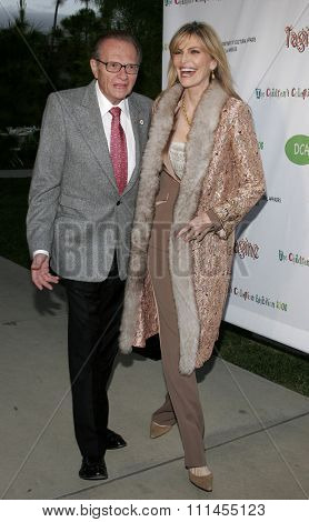 Larry King and Shawn Southwick-King attend the opening of 