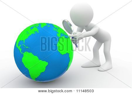 Hombre con gran lupa mirando la tierra