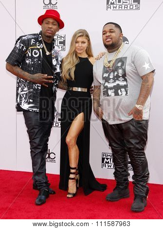 LOS ANGELES, CA - NOVEMBER 23, 2014: YG, DJ Mustard and Fergie at the 2014 American Music Awards held at the Nokia Theatre L.A. Live in Los Angeles on November 23, 2014.