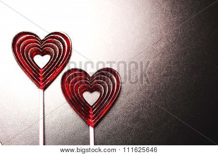 Red heart-shape lollipops