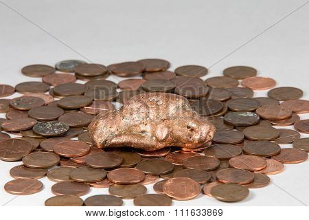 Copper Nugget On A Bed Of Pennies