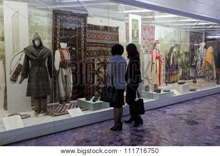 ST. PETERSBURG, RUSSIA - DECEMBER 14, 2015: Women watching the exposition in the Russian Museum of Ethnography during 4th St. Petersburg Cultural Forum. Business venue's events were held here