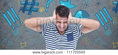 Frustrated man covering ears against dirty old wall background