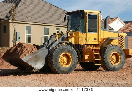 Front End Loader op huis veel