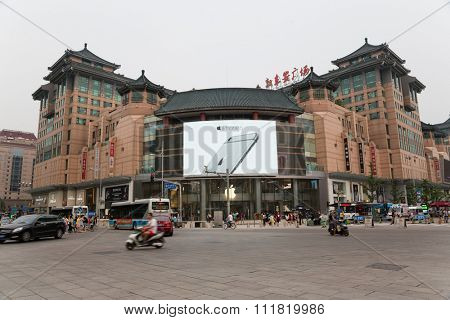 BEIJING - CIRCA JUNE , 2015: Banner at the Apple store advertising smartphone Apple iPhone 6 in Wangfujing shopping area. Wangfujing street is located in the city center and is popular with tourists.