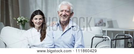 Senior Man With Care Assistant