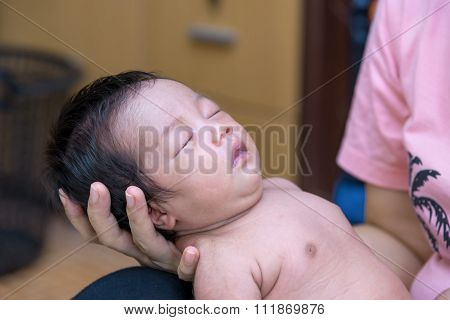 Newborn Baby Sleep On The Hand Of Mother