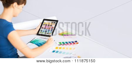 interior design, renovation and technology concept - woman working with color samples for selection