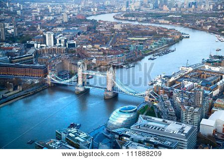 City of London panorama at sunset. River Thames, Tower bridge and Canary Wharf in the distance. Aeri