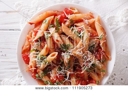 Arrabiata Pasta Penne With Parmesan Cheese Closeup. Horizontal Top View
