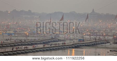 ALLAHABAD, INDIA - FEBRUARY 06, 2013: Thousands of Hindu devotees crossing the pontoon bridges over the Ganges River at Maha Kumbh Mela festival in Allahabad, India.