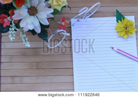 Writing Paper And Pen Placed On A Wooden Brown Background