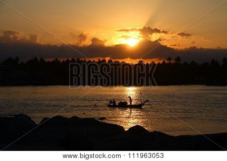 Sunset and small boat