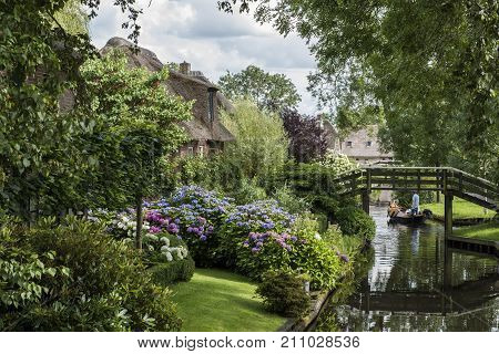 Giethoorn The Netherlands - July 30 2016: Front with Hydrangea of a monumental house in the small picturesque town of Giethoorn Overijssel Netherlands.