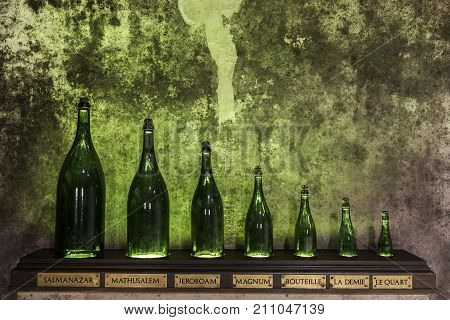 Reims France - June 14 2017: the caves of Champagne House Mumm with different sizes of bottles France.