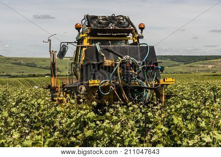 Champagne France - June 8 2017: Wine farmer with machinery for the vineyards in Champagne district France.