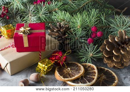 Red Christmas  Gift  Box With Red Ribbon And Fir Branches