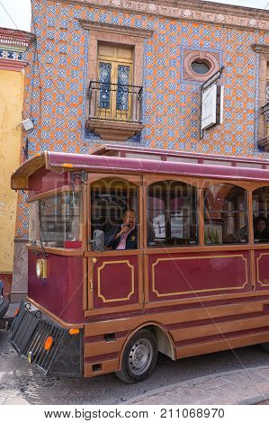 February 26 2016 Bernal Queretaro Mexico: tourist tour bus drives through the historic town center