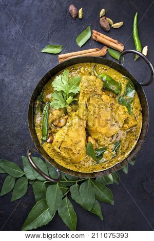 Traditional Indian curry chicken as close-up in a Korai 