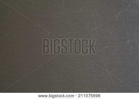 Worn stainless steel macro shot with blurry edges