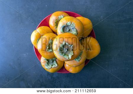 Ripe persimmon . Concept - healthy eating vegetarianism. Selective focus.